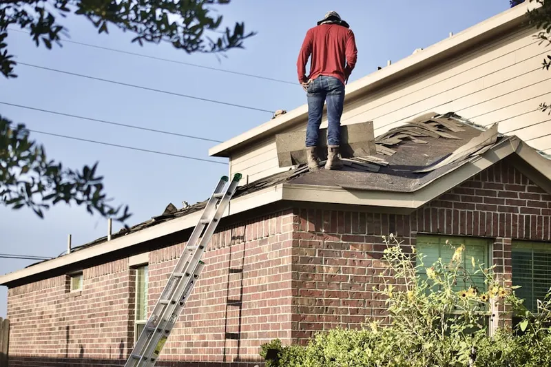 Professional roofer working on a residential roof in Bannertown